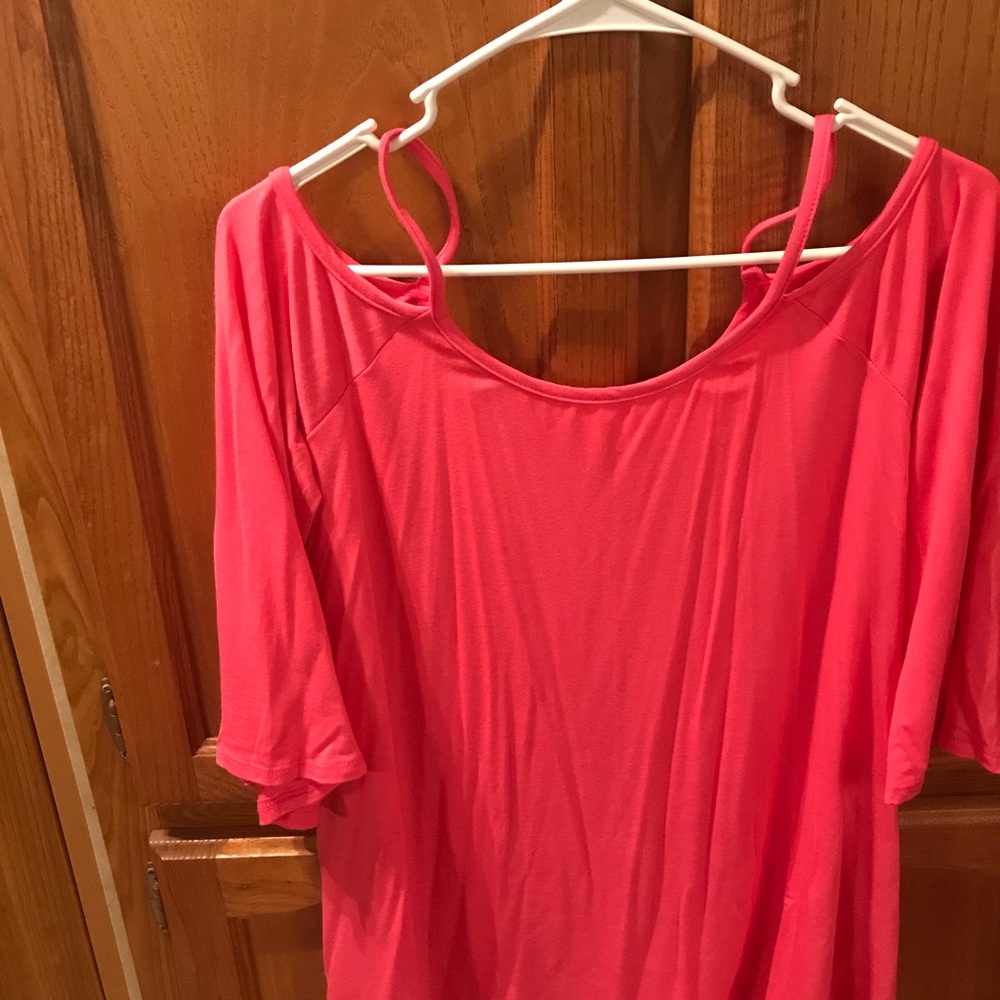 Spaghetti strap top with sleeves.